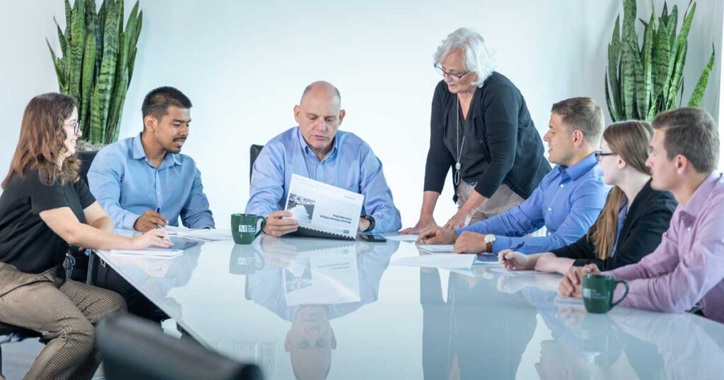 Group of Mason Employees meeting at a table